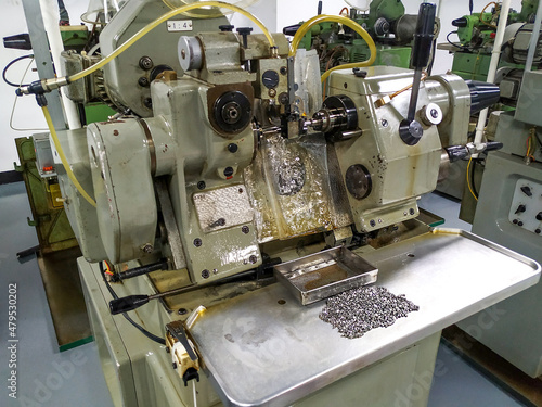 A series of lathes for watchmaking at a factory in China. Production of parts at the production site. Workshop, site