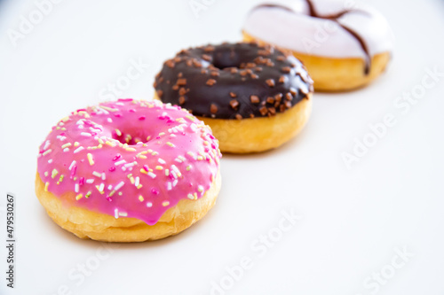 Three different kind of donuts isolated on white.