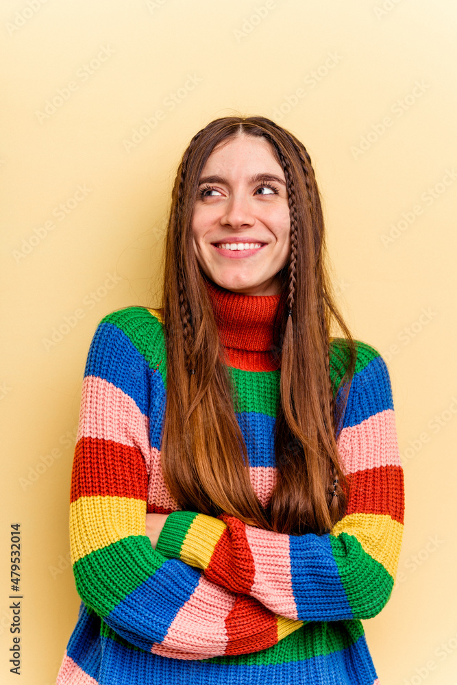 Young caucasian woman isolated on yellow background Young caucasian woman isolated on yellow background