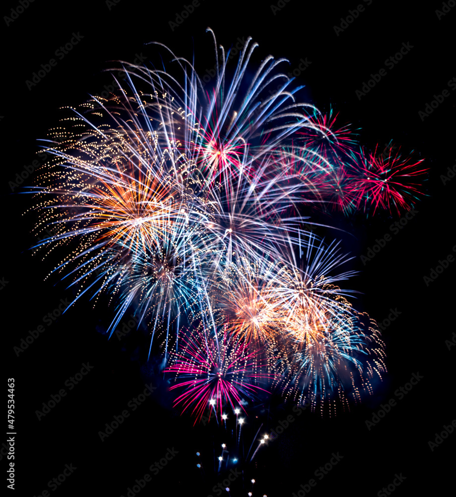 Fireworks exploding against dark sky Fireworks exploding against dark sky