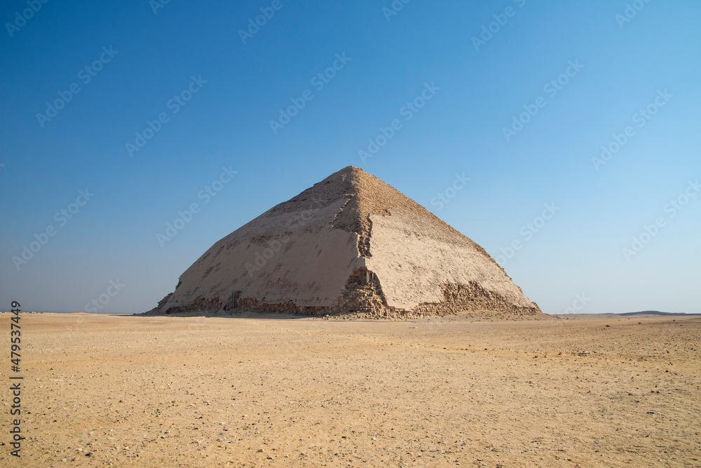The Pyramid of Bent (also known as the False, or Rhomboidal Pyramid because the angular slope changed) of Pharaoh Sneferu with a well-preserved original limestone casing. Egypt. Dahshur (or Dashur).