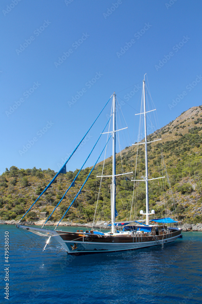 Brown gulet moored in Aegean Sea - Ölüdeniz Beach and aquarium kyou, Ölüdeniz Beach Turkey's best beaches - Fethiye, Turkey