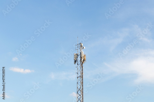 Communication tower telephone pole wireless communication technology. Telecommunication tower of 4G and 5G cellular. Smart antennas mounted on a metal against with sunlight cloud sky is background.