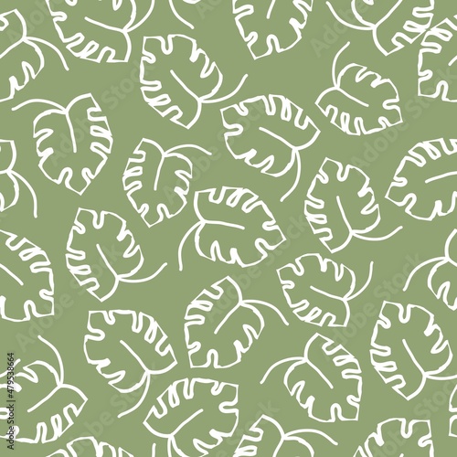 Beautiful vintage pattern. Monstera leaves. White outline. Green background. Floral seamless background. An elegant template for fashionable prints.