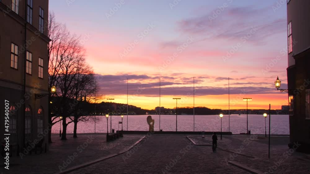 Beautiful view of the colorful sunset during dawn shot from Gamla Stan old town on Evert Taubes Terrass, GamlaStan, Stockholm, Sweden. 1080 Beautiful view of the colorful sunset during dawn shot from Gamla Stan old town on Evert Taubes Terrass, GamlaStan, Stockholm, Sweden. 1080