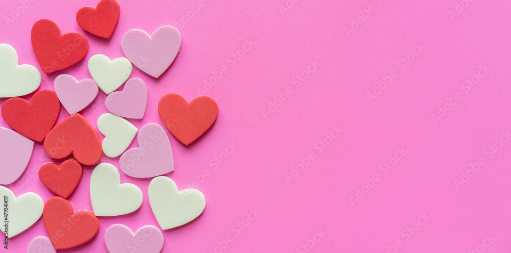 close up top view on colorful heart shape on pink color background for donation charity and valentine festival concept