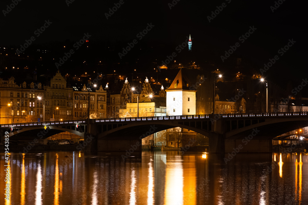 Prague at night, view of bridges on the Vlatava river, reflection of night city lights, cityscape