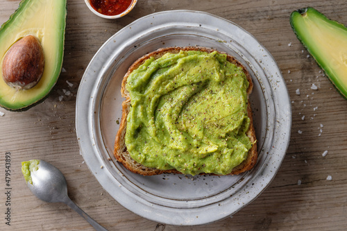 Tasty fresh toast with mashed avocado