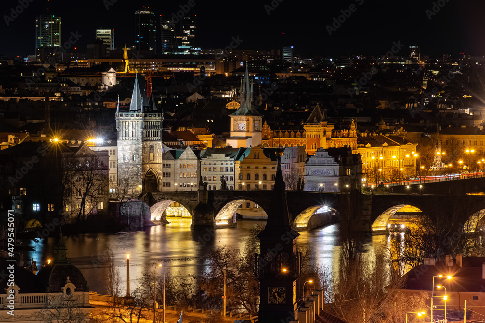 Prague at night, Charles bridge, reflection of lights in the Vltava river, cityscape