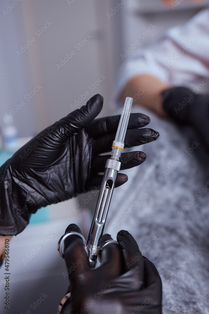 Little girl at dentist office, getting local anesthesia injection into gums. Cropped view of the