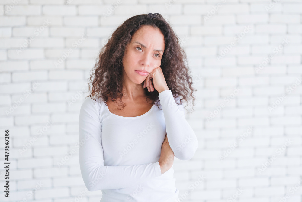 Portrait African American millennial women feeling stressed and worried after overwork. Younger females have symptoms of afflicted onset syndrome. Office workers are feeling bored.