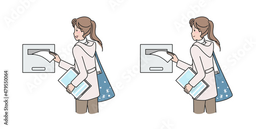 ポスティングをする若い女性　冬