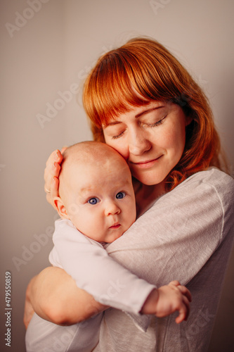 mother and her little baby hugging together