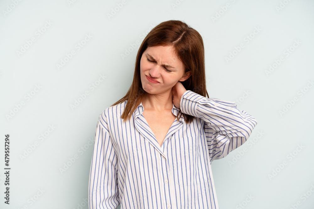 Young English woman isolated on blue background suffering neck pain due to sedentary lifestyle. Young English woman isolated on blue background suffering neck pain due to sedentary lifestyle.