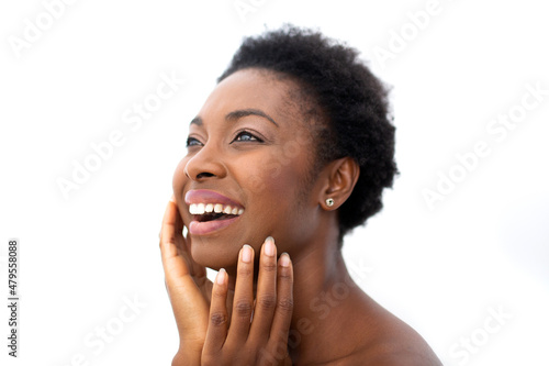 Close up smiling beautiful young african American woman with hands on face by isolated white background