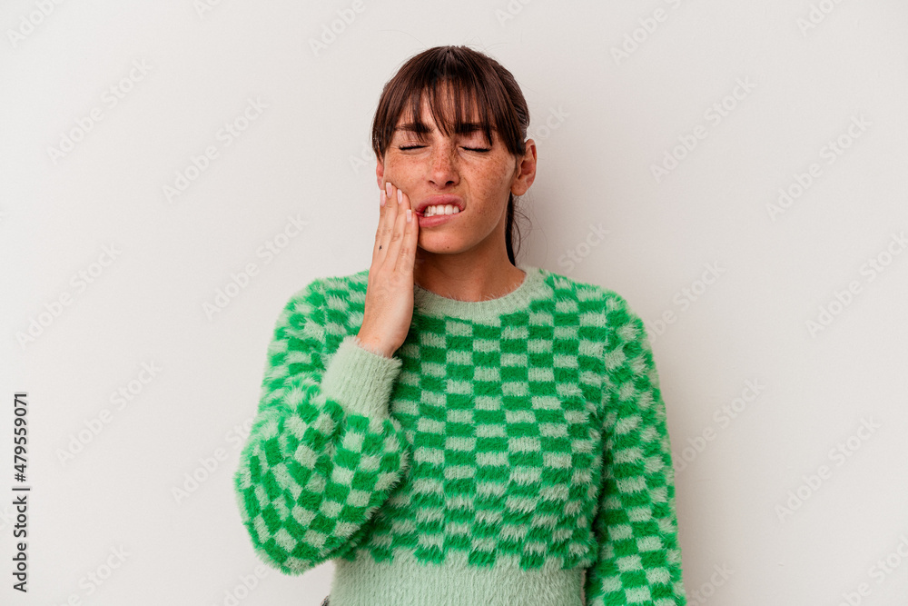 Young Argentinian woman isolated on white background having a strong teeth pain, molar ache. Young Argentinian woman isolated on white background having a strong teeth pain, molar ache.