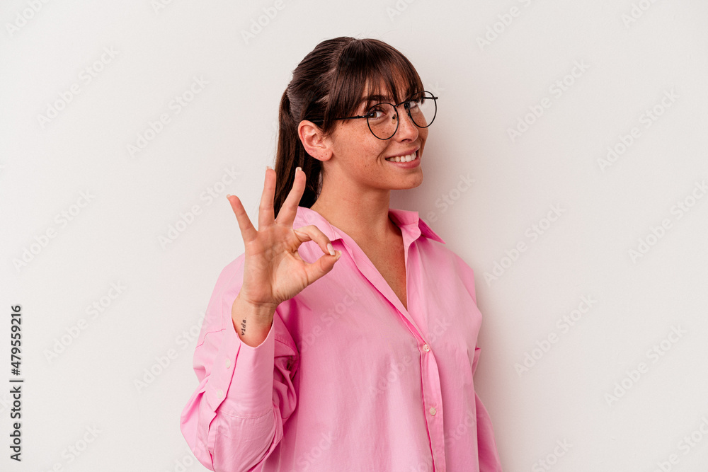 Young Argentinian woman isolated on white background cheerful and confident showing ok gesture. Young Argentinian woman isolated on white background cheerful and confident showing ok gesture.