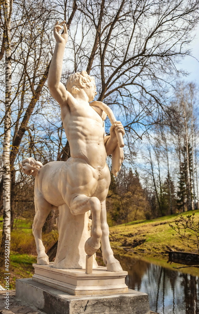 Ancient sculpture of a centaur on a bridge in Pavlovsky Park in St. Petersburg