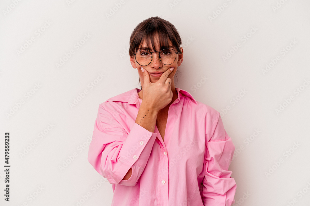 Young Argentinian woman isolated on white background doubting between two options.