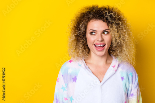 Portrait of attractive cheerful wavy-haired girl thinking copy space good idea isolated over bright yellow color background