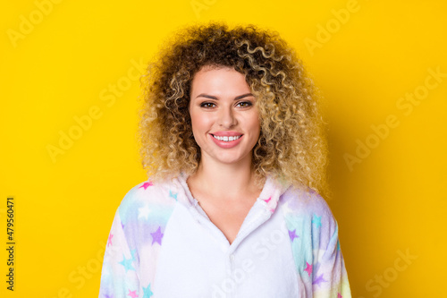 Portrait of attractive cheerful wavy-haired girl wearing pijama wake up isolated over bright yellow color background