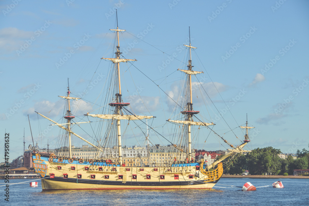 the water an old sailing frigate with guns