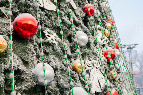 Red and white balls of Christmas toys on the Christmas tree, Christmas decorations and lights.  photo