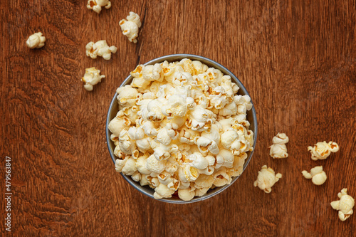 Popcorn on a wooden background viewed from above. Top view