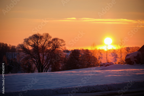 sunset in cold winter morning in country side with snow © Martins