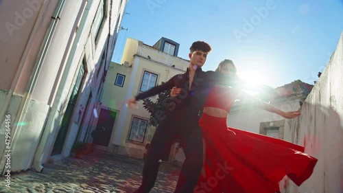 Beautiful Couple Dancing a Latin Dance on the Quiet Street of an Old Town in a City. Sensual Dance by Two Professional Dancers on a Sunny Day Outside in Ancient Culturally Rich Tourist Location.