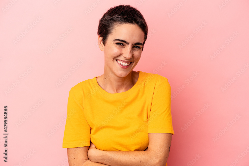 Young caucasian woman isolated on blue background laughing and having fun. Young caucasian woman isolated on blue background laughing and having fun.