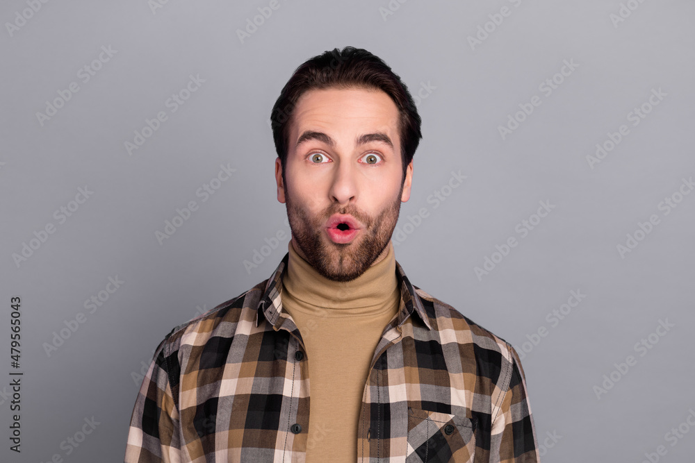 Fototapeta premium Photo of charming shocked guy dressed checkered shirt big eyes isolated grey color background