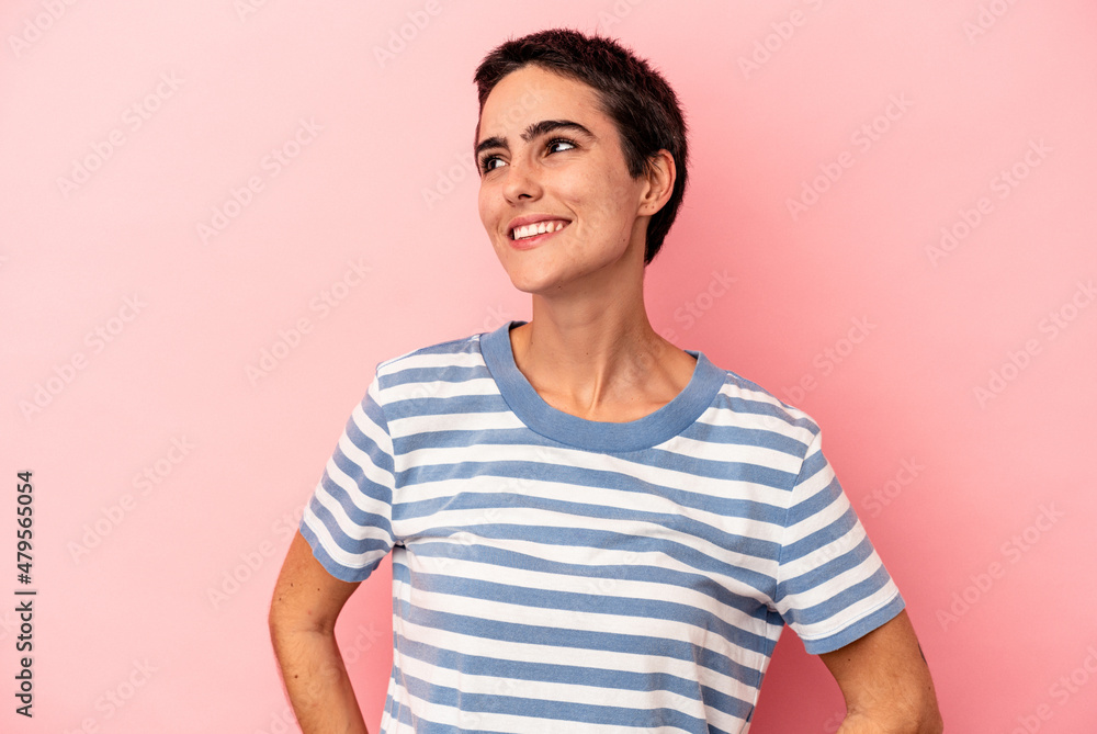 Young caucasian woman isolated on blue background relaxed and happy laughing, neck stretched showing teeth. Young caucasian woman isolated on blue background relaxed and happy laughing, neck stretched showing teeth.