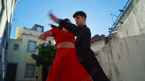 Beautiful Couple Dancing a Latin Dance on the Quiet Street of an Old Town in a City. Sensual Dance by Two Professional Dancers on a Sunny Day Outside in Ancient Culturally Rich Tourist Location.