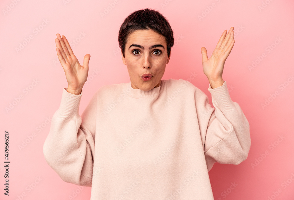 Young caucasian woman isolated on blue background surprised and shocked. Young caucasian woman isolated on blue background surprised and shocked.
