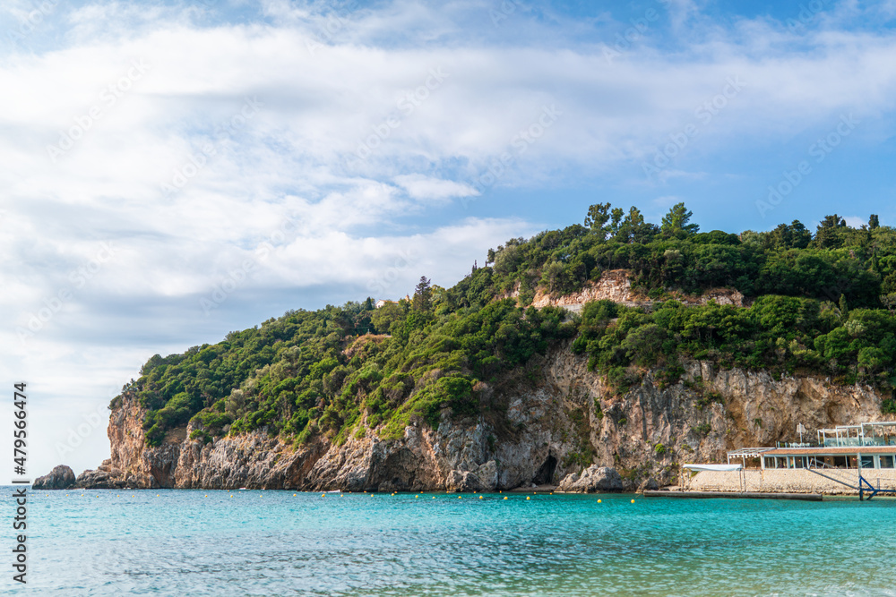 Calm beach of Mediterranean sea near high hill with forest Calm beach of Mediterranean sea near high hill with forest