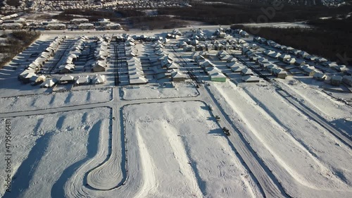 Flying above snow covered grounds prepared for building new houses in city subdivision in Nicholasville, Kentucky in the outskirts of the mid western city of Lexington, USA photo