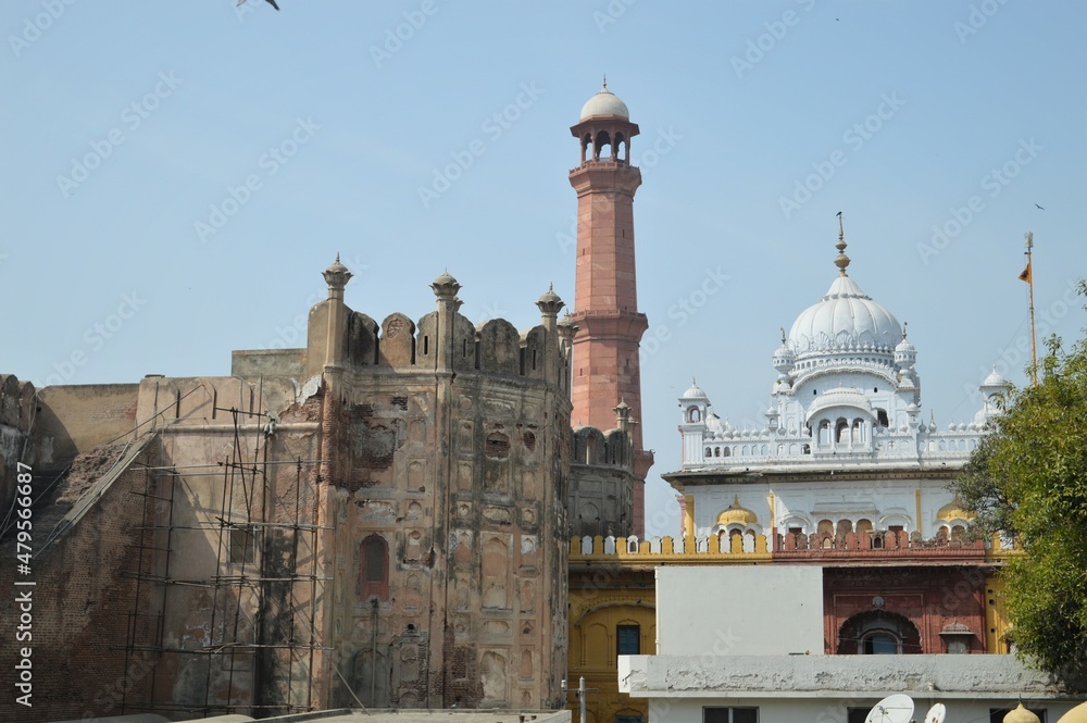 LAHORE FORT, PAKISTAN - JANUARY 20, 2017: iconic view of badshahi mosque, samadhi of ranjit singh and lahore fort for background, selective focus