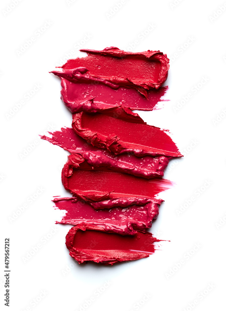 Swatches of red lipstick isolated on white background