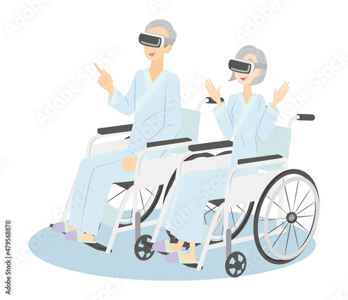 入院中に車椅子に座りVRを使って楽しむシニアの男女