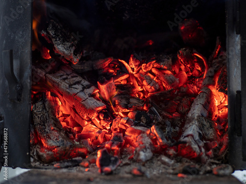 Details of charcoal in the furnace. Burning firewood in the grill.