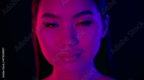 Wallpaper Mural Blurred Closeup Portrait Of Young Beautiful Asian Woman Standing Under Neon Lighting Torontodigital.ca