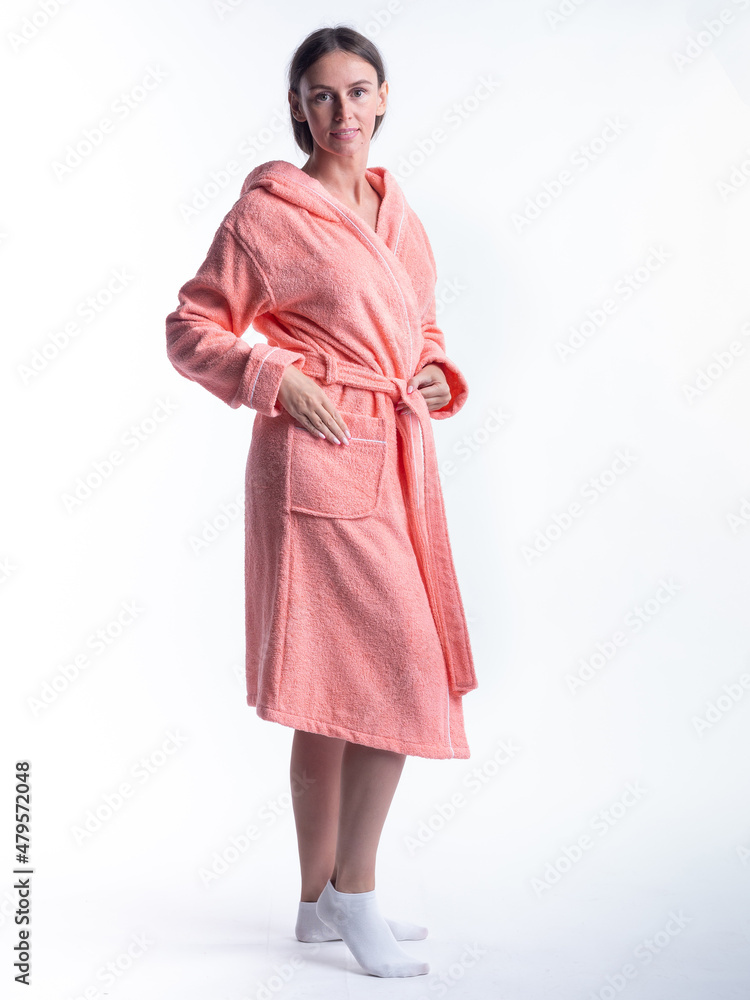woman in a Bathrobe on an isolated white background with a smile on her face. woman in a Bathrobe on an isolated white background with a smile on her face.