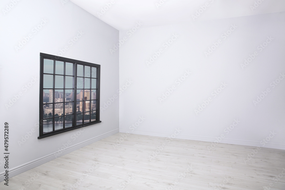 Parquet floor and wooden window in light empty room Parquet floor and wooden window in light empty room
