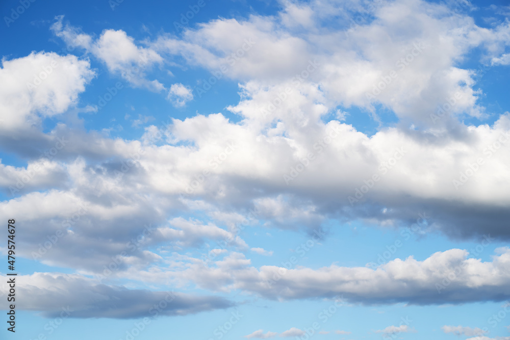 blue sky background with tiny clouds