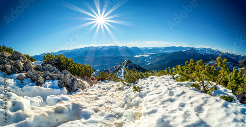 Hiking Path along the Herzogstand Mountain with view to the Martinskopf peak and the Karwendel mountain chain photo