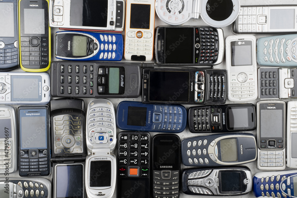 Prague, CZ - 12 December 2021: A lot of old used mobile phones with  keyboards, Various brands. Many types and generations of mobile smartphone  gadgets are in heap. Editorial Stock-Foto | Adobe Stock