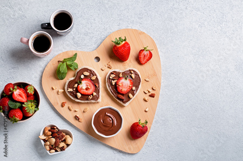 Breakfast for two, Valentines day food for couple in love with chocolate toasts and strawberry, web banner