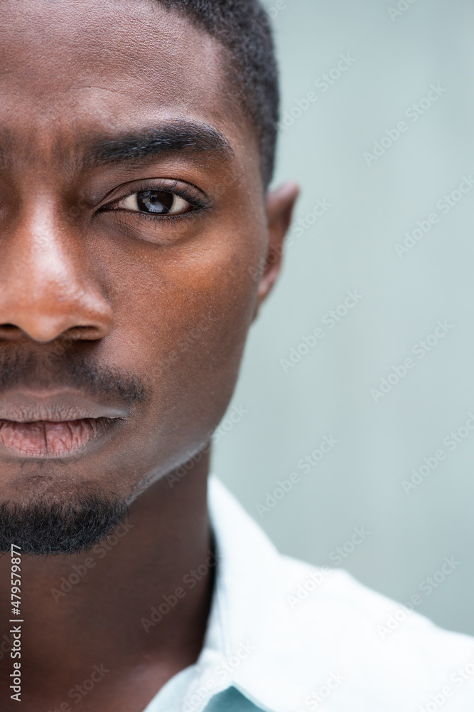 Fototapeta premium Close up handsome half face African American man