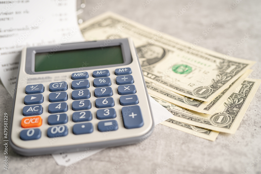 Grocery shopping list receipts with calculator and US dollar banknotes money. Grocery shopping list receipts with calculator and US dollar banknotes money.